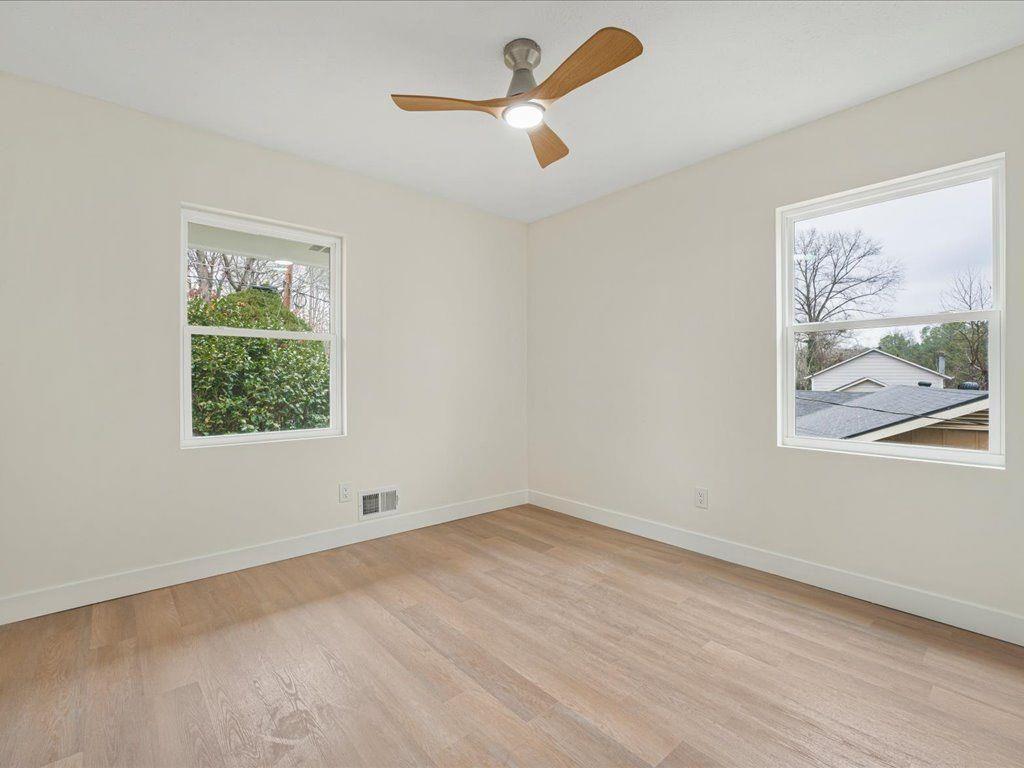 2874 Cocklebur Cove Court Decatur, GA 30034 - Photo 24 of 36 wooden floor in an empty room with a window