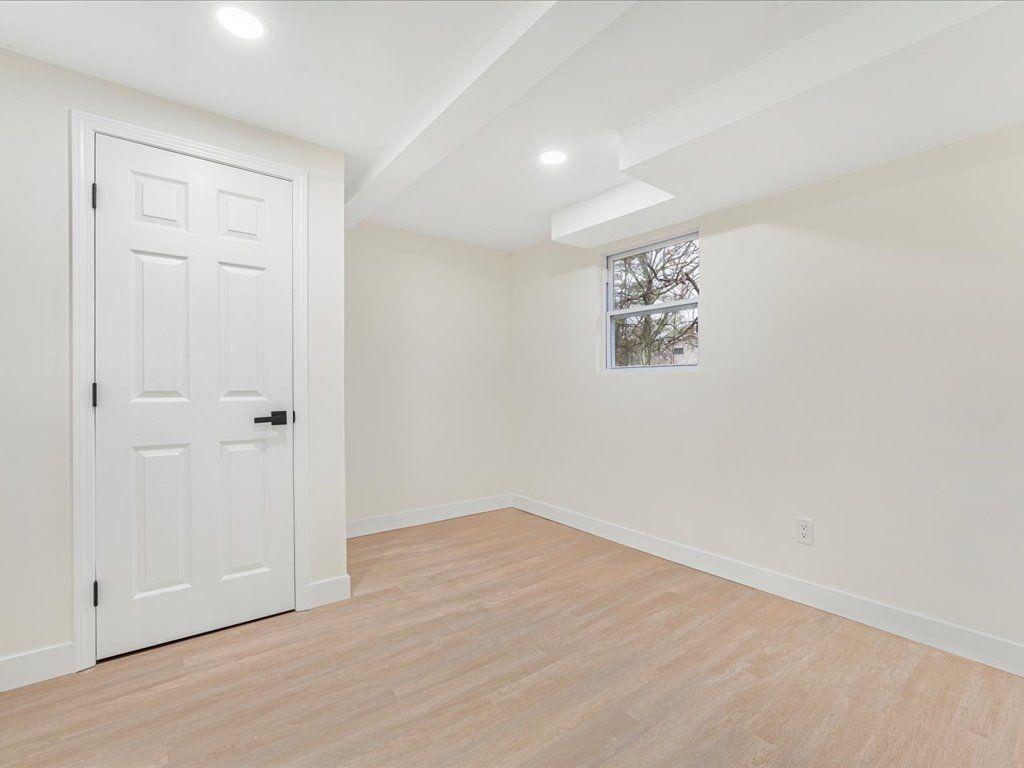 2874 Cocklebur Cove Court Decatur, GA 30034 - Photo 29 of 36 an empty room with wooden floor