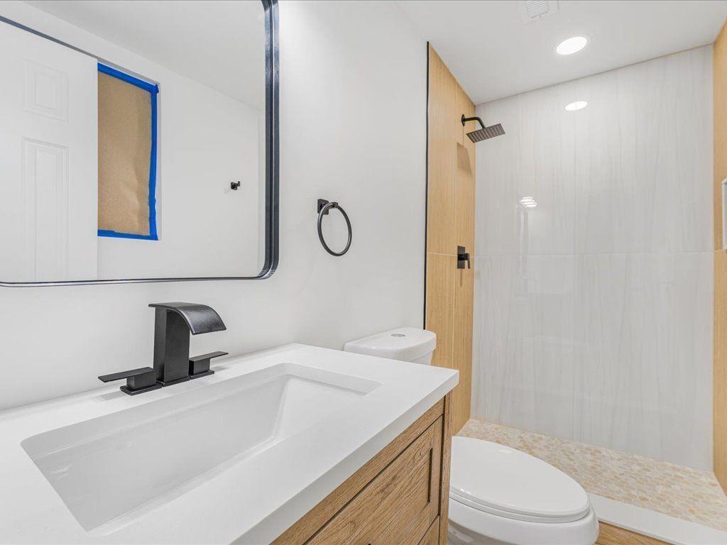 2874 Cocklebur Cove Court Decatur, GA 30034 - Photo 32 of 36 a bathroom with a sink a toilet and shower