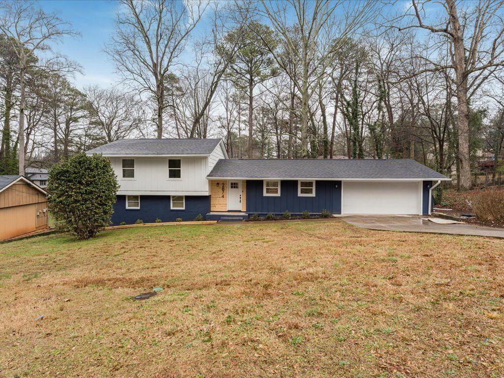 2874 Cocklebur Cove Court Decatur, GA 30034 - Photo 35 of 36 a front view of a house with a yard and garage