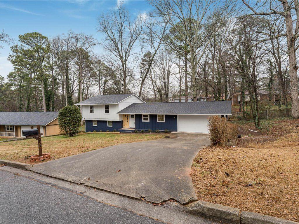 2874 Cocklebur Cove Court Decatur, GA 30034 - Photo 36 of 36 a front view of a house with a yard and garage