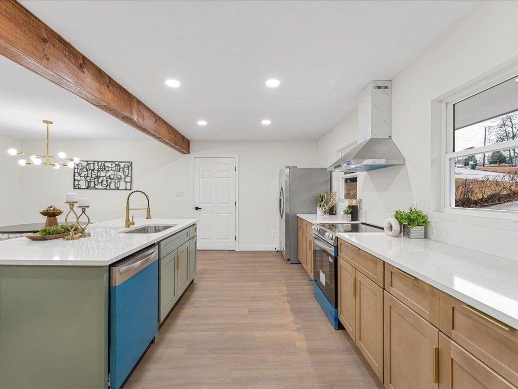 2874 Cocklebur Cove Court Decatur, GA 30034 - Photo 7 of 36 a large kitchen with stainless steel appliances granite countertop a sink and a stove top oven