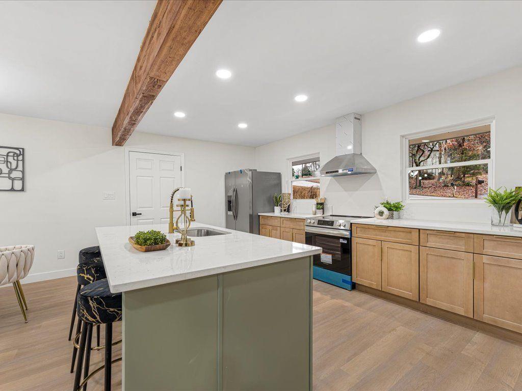 2874 Cocklebur Cove Court Decatur, GA 30034 - Photo 8 of 36 a kitchen with sink cabinets and chairs