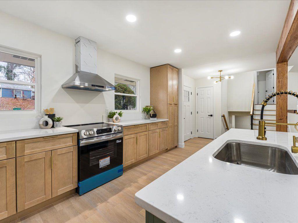 2874 Cocklebur Cove Court Decatur, GA 30034 - Photo 9 of 36 a kitchen with stainless steel appliances granite countertop a sink a stove and a refrigerator