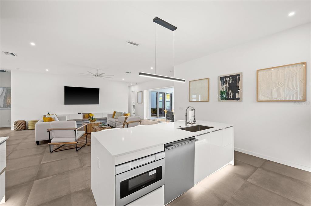 2375 Waldemere Street Sarasota, FL 34239 - Photo 12 of 36 a view of living room with granite countertop furniture and a flat screen tv