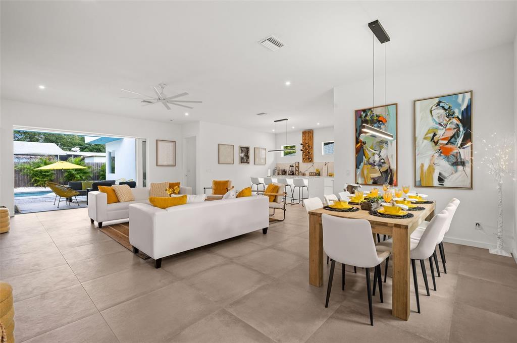 2375 Waldemere Street Sarasota, FL 34239 - Photo 2 of 36 a living room with furniture and a large window