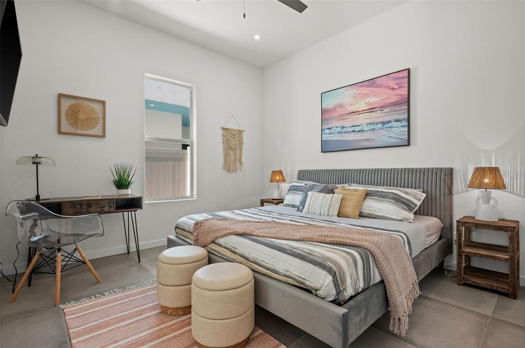 2375 Waldemere Street Sarasota, FL 34239 - Photo 21 of 36 a bedroom with a bed and a table in it