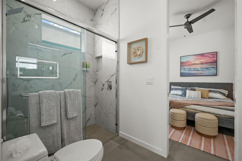 2375 Waldemere Street Sarasota, FL 34239 - Photo 22 of 36 a bathroom with a toilet sink and shower