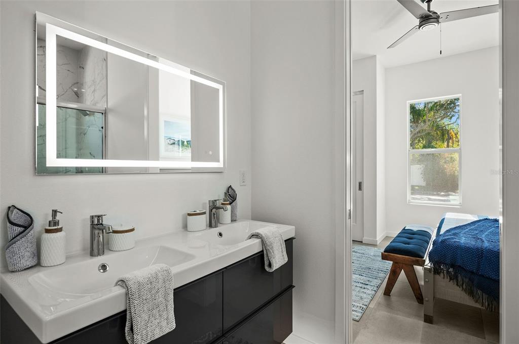 2375 Waldemere Street Sarasota, FL 34239 - Photo 28 of 36 a bathroom with a sink and a mirror