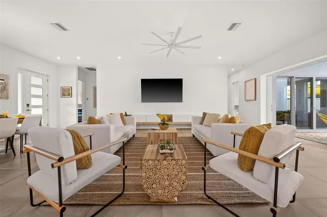 a living room with furniture and a flat screen tv