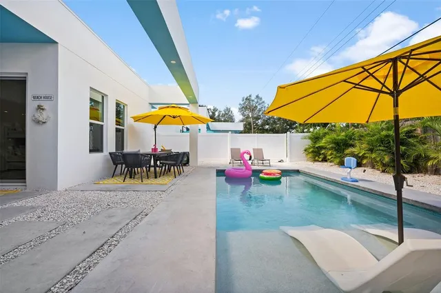 a view of a swimming pool with a patio