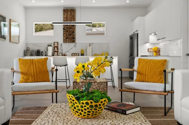 a living room with furniture and a rug