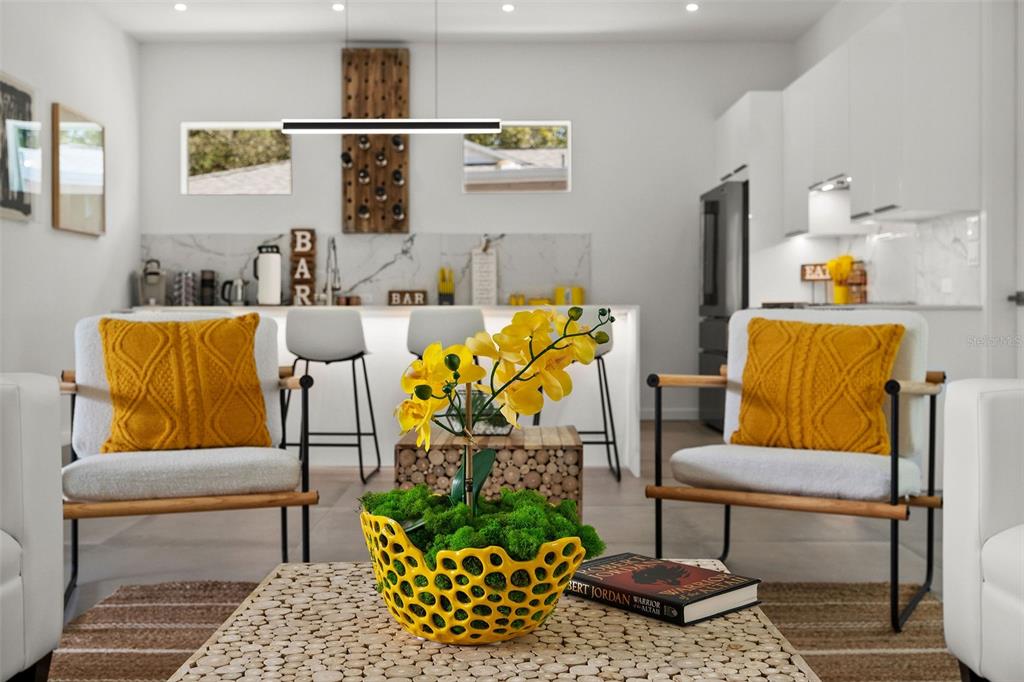 2375 Waldemere Street Sarasota, FL 34239 - Photo 7 of 36 a living room with furniture and a rug