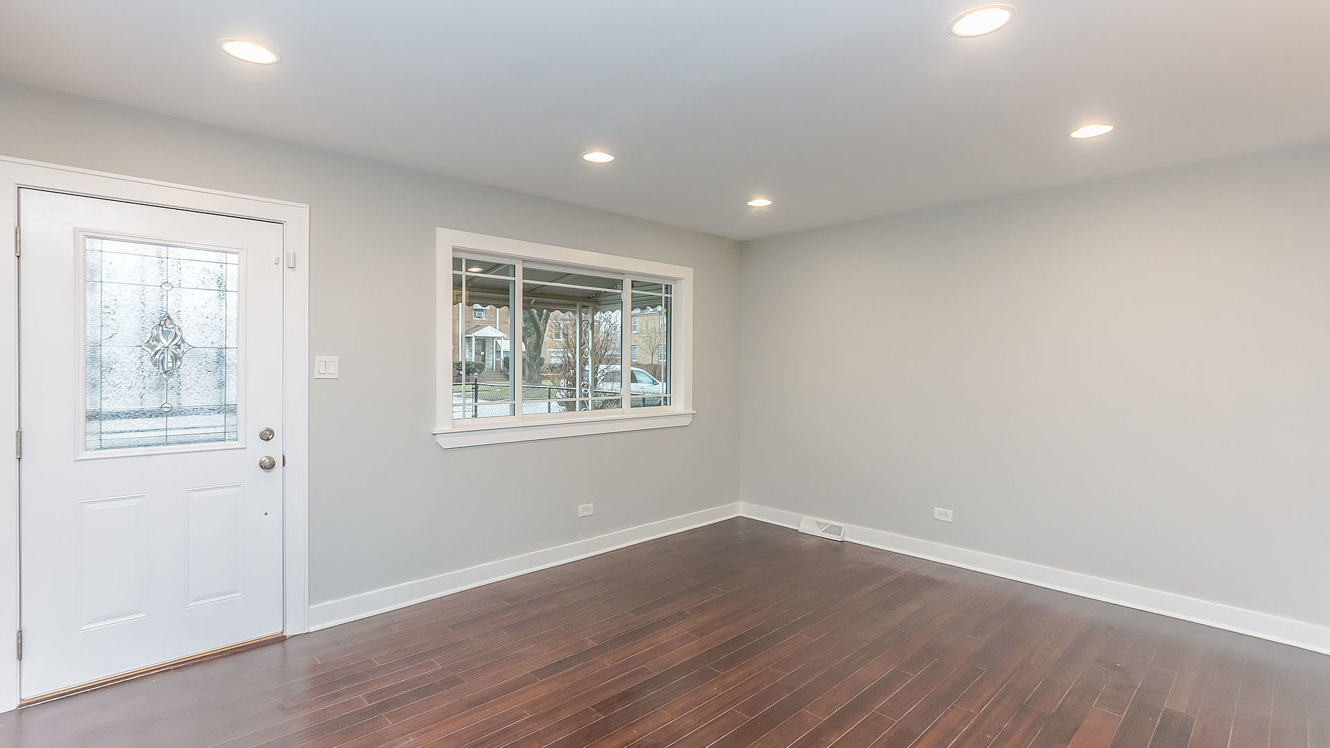 1159 West 112th Street Chicago, IL 60643 - Photo 5 of 27 an empty room with wooden floor and windows