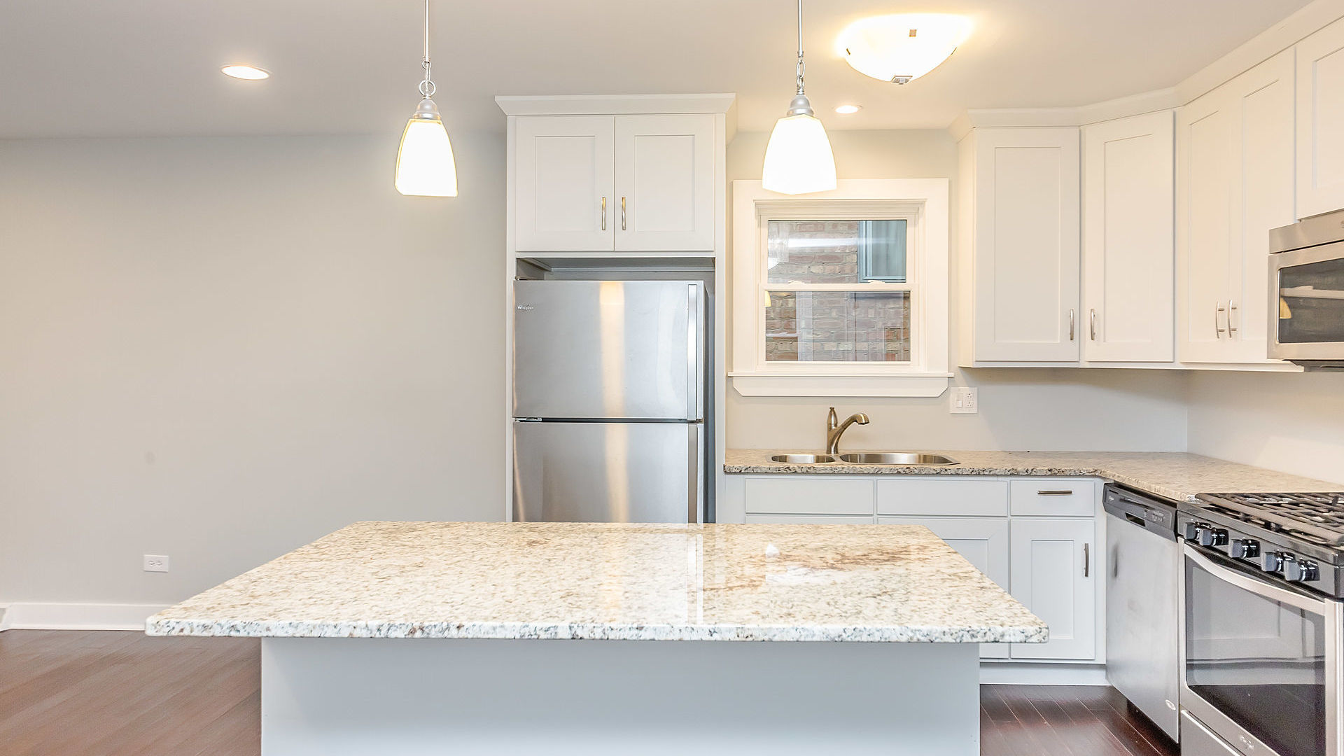 1159 West 112th Street Chicago, IL 60643 - Photo 6 of 27 a kitchen with granite countertop a sink stainless steel appliances and cabinets