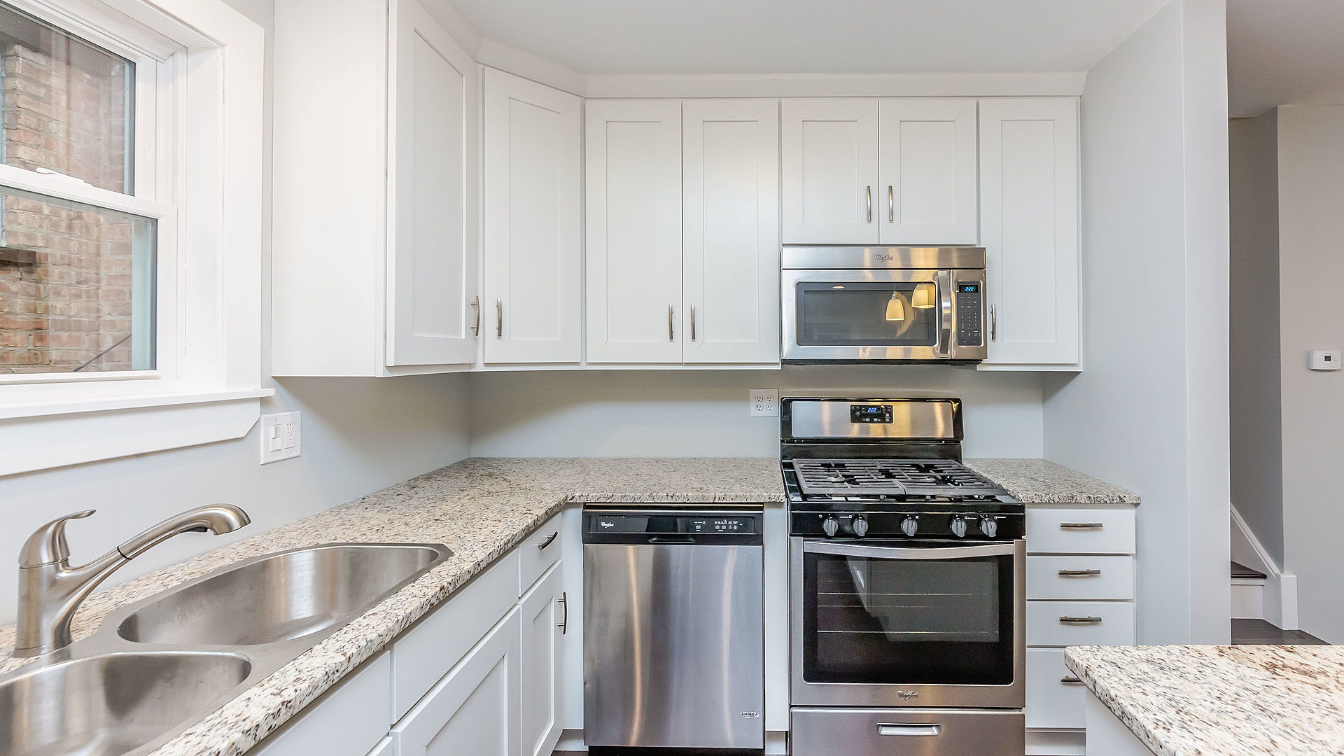 1159 West 112th Street Chicago, IL 60643 - Photo 8 of 27 a kitchen with granite countertop a sink stainless steel appliances and cabinets