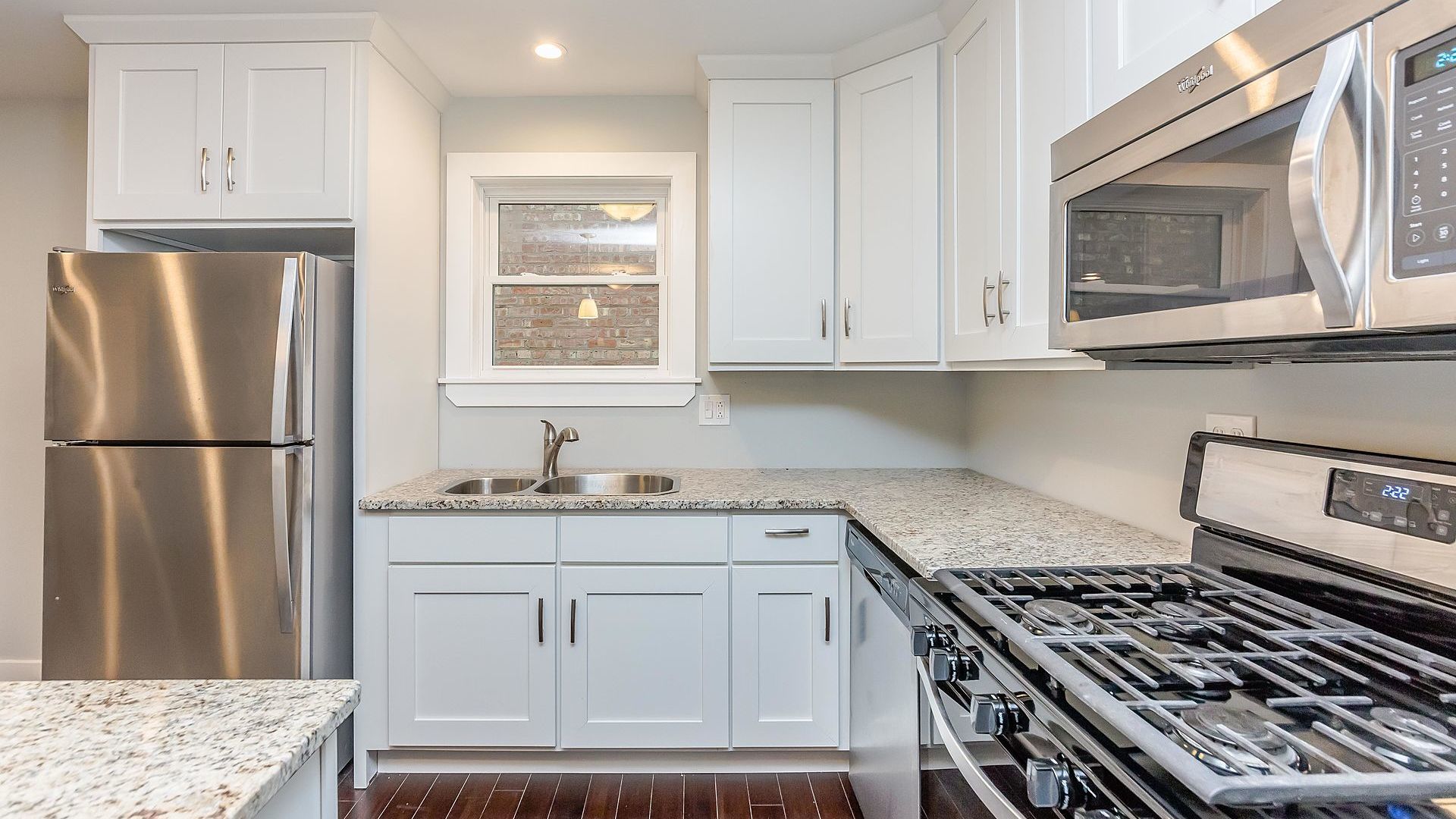 1159 West 112th Street Chicago, IL 60643 - Photo 9 of 27 a kitchen with white cabinets and appliances
