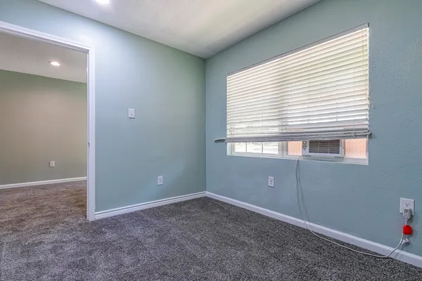 an empty room with windows