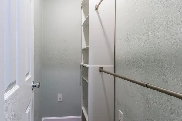 a bathroom with a sink a mirror and a shower