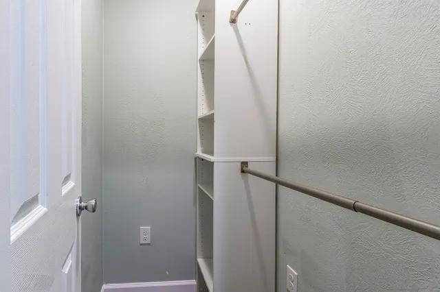 a bathroom with a sink a mirror and a shower