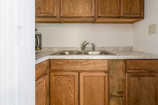 an empty room with closet and a bathroom