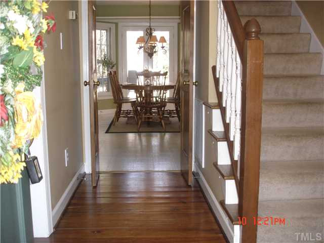 325 Sandhurst Road Raleigh, NC 27615 - Photo 3 of 12 Wonderful Heart of Pine Floors greet you as you enter this magnificent home. They also continue into the Dining Room! Notice nice Bay Window with Doors that exit to the wonderful deck for entertaining! Foyer