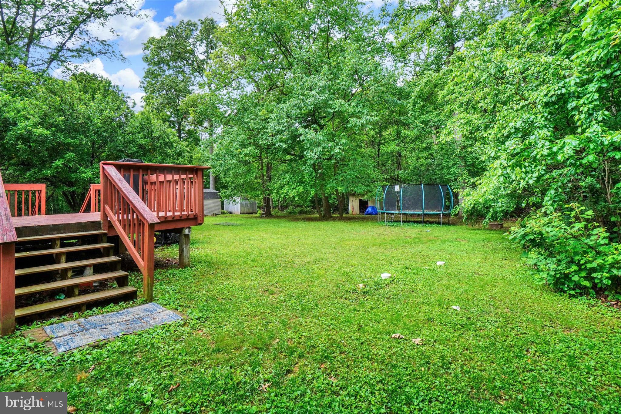 5677 Woods Road Stewartstown, PA 17363 - Photo 24 of 26 a view of a backyard with a garden