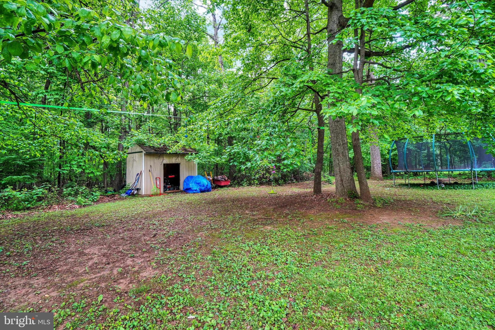 5677 Woods Road Stewartstown, PA 17363 - Photo 26 of 26 a yellow house with trees in front of it