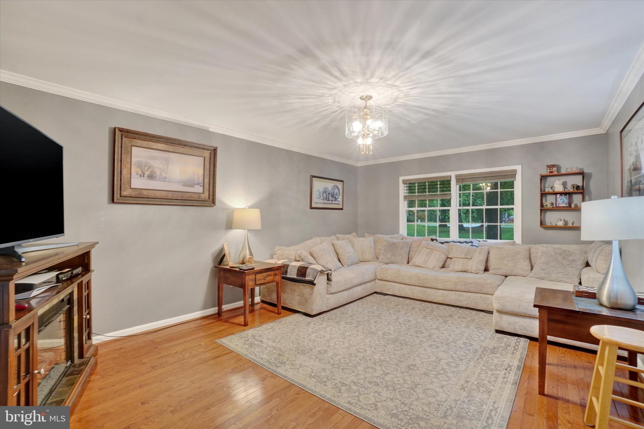 5677 Woods Road Stewartstown, PA 17363 - Photo 3 of 26 a living room with furniture and a flat screen tv