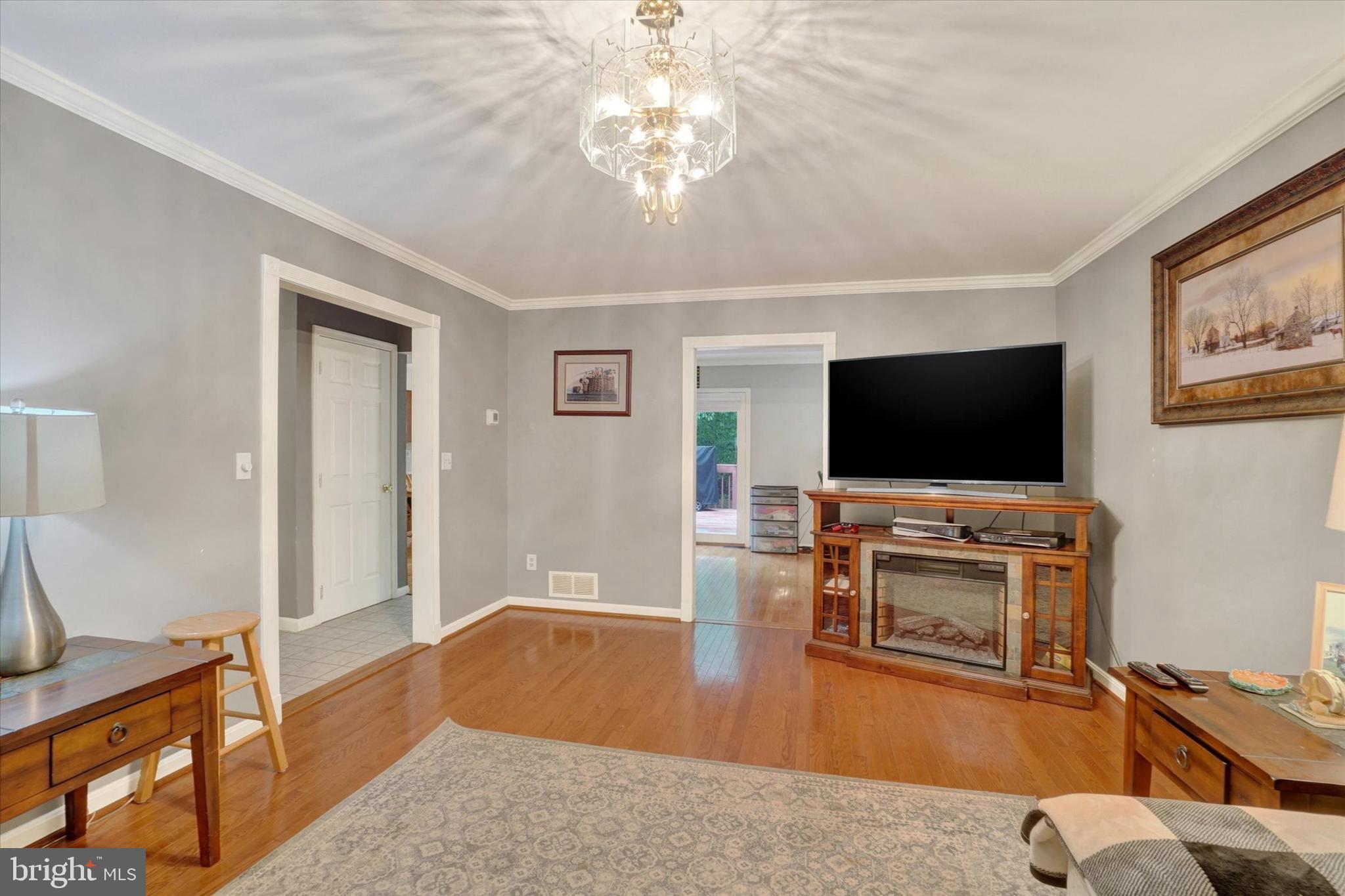 5677 Woods Road Stewartstown, PA 17363 - Photo 4 of 26 a living room with furniture and a flat screen tv