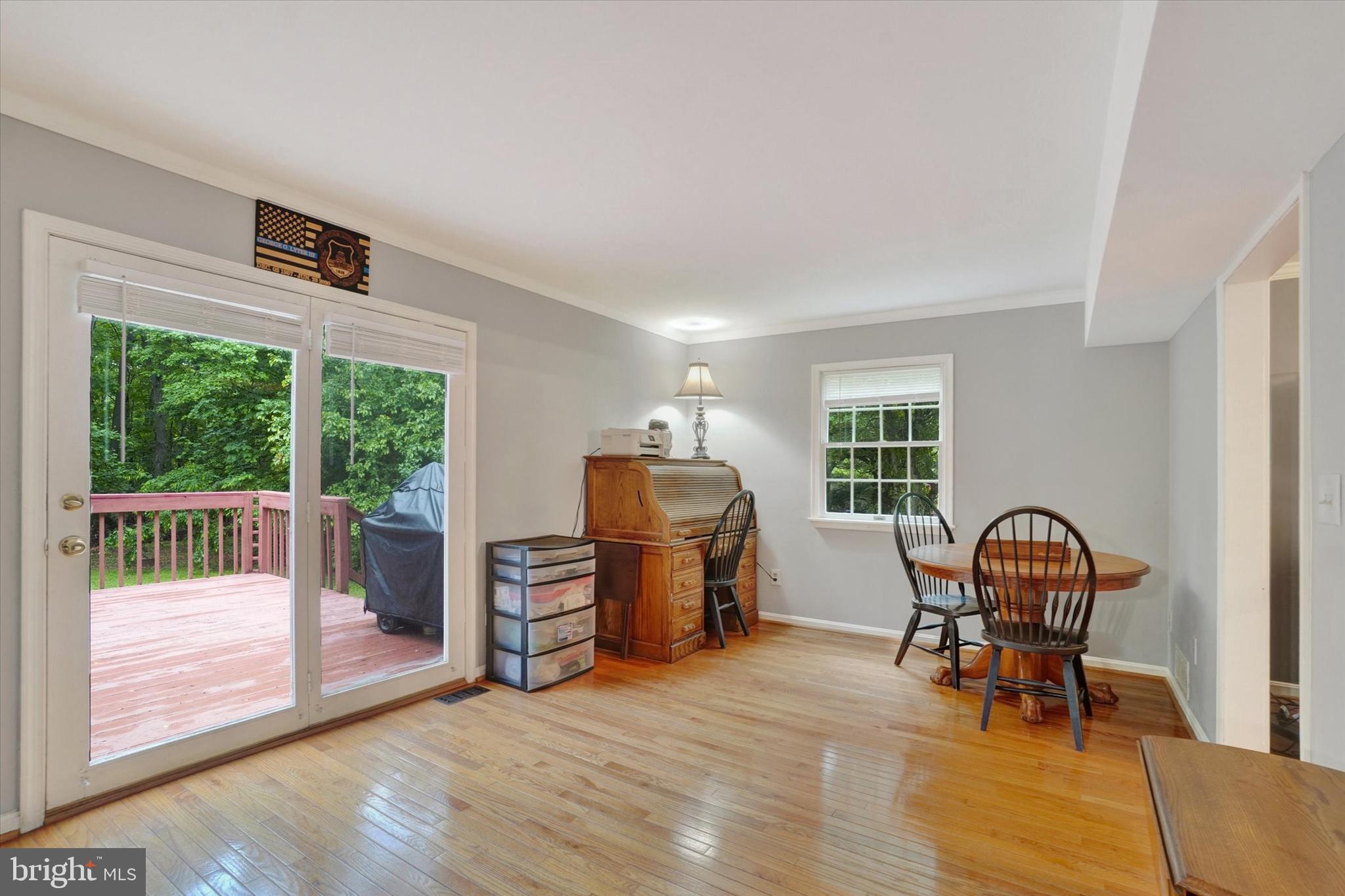 5677 Woods Road Stewartstown, PA 17363 - Photo 5 of 26 a living room with furniture and a window