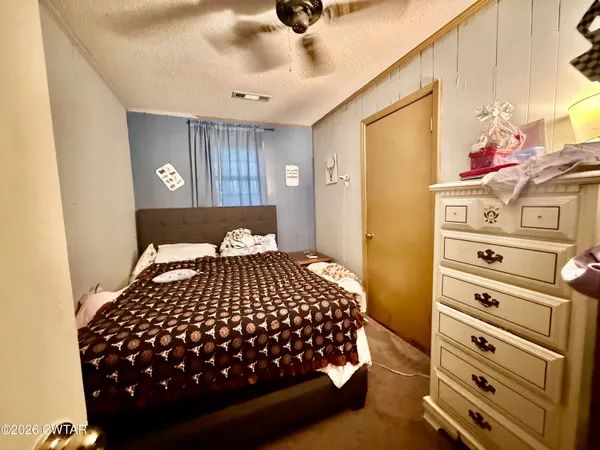 a bedroom with a bed and a closet