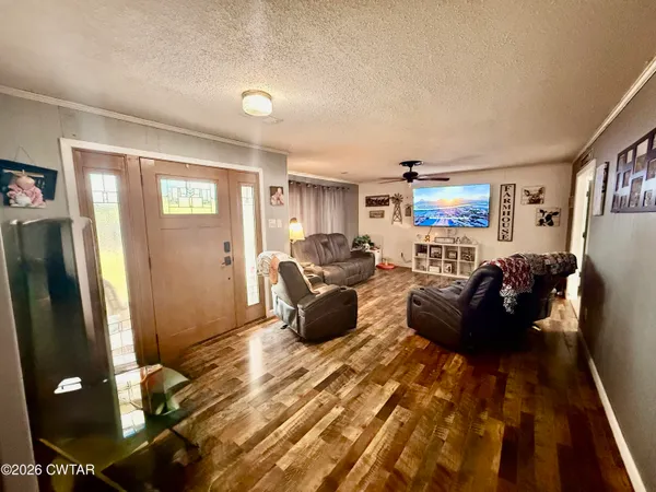 a living room with furniture and a window