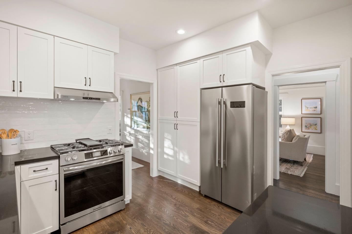 445 Arlington Road Redwood City, CA 94062 - Photo 13 of 50 a kitchen with white cabinets and stainless steel appliances