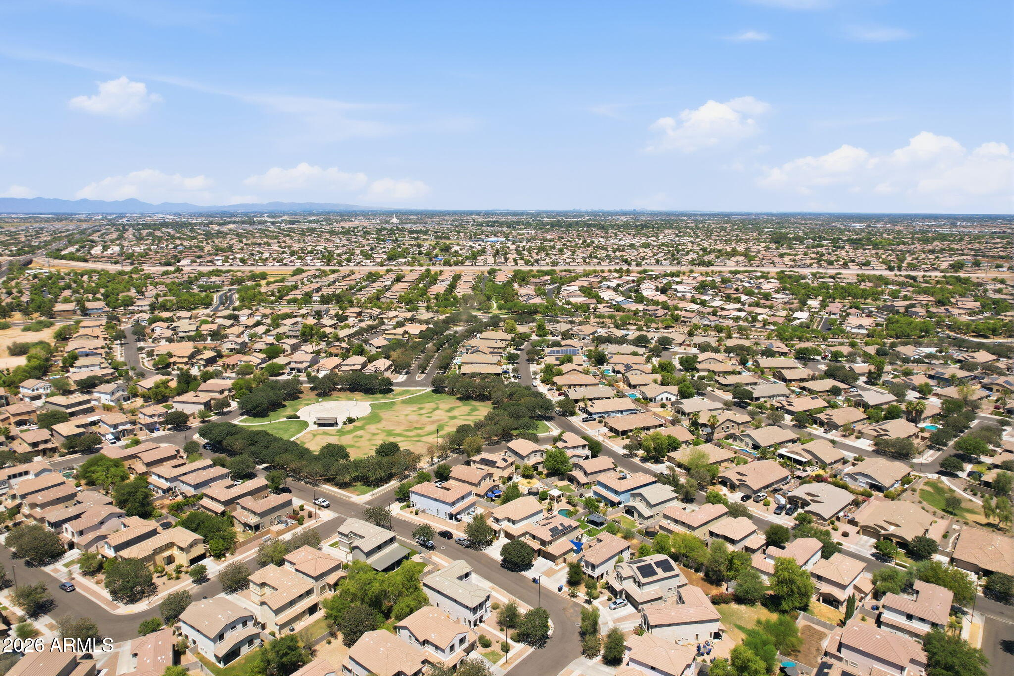 4184 East Trigger Way Gilbert, AZ 85297 - Photo 46 of 51 an aerial view of a houses with a city view