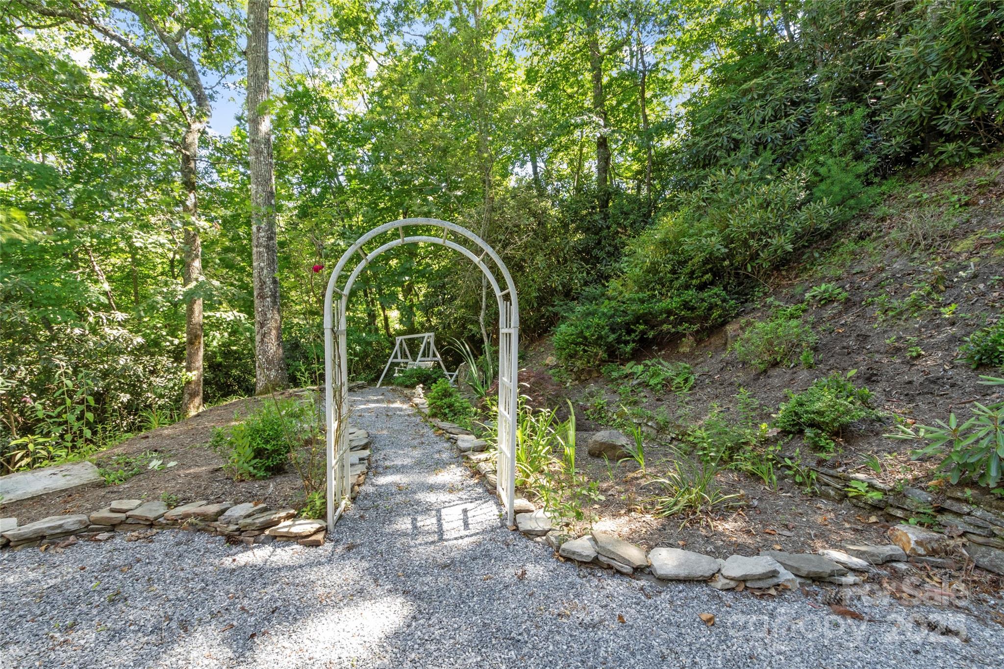 141 Wildflower Road Spruce Pine, NC 28777 - Photo 4 of 22 a backyard of a house with lots of green space