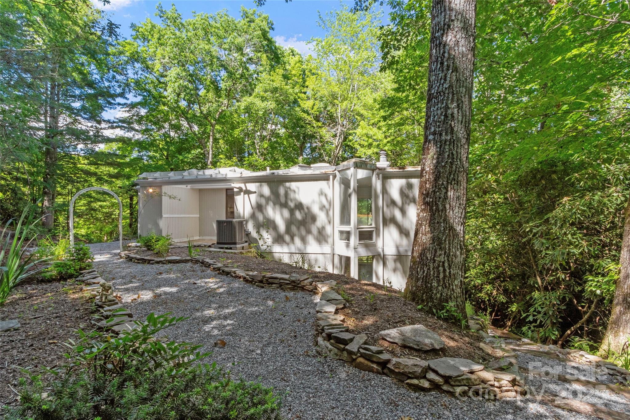 141 Wildflower Road Spruce Pine, NC 28777 - Photo 6 of 22 a view of a house with backyard