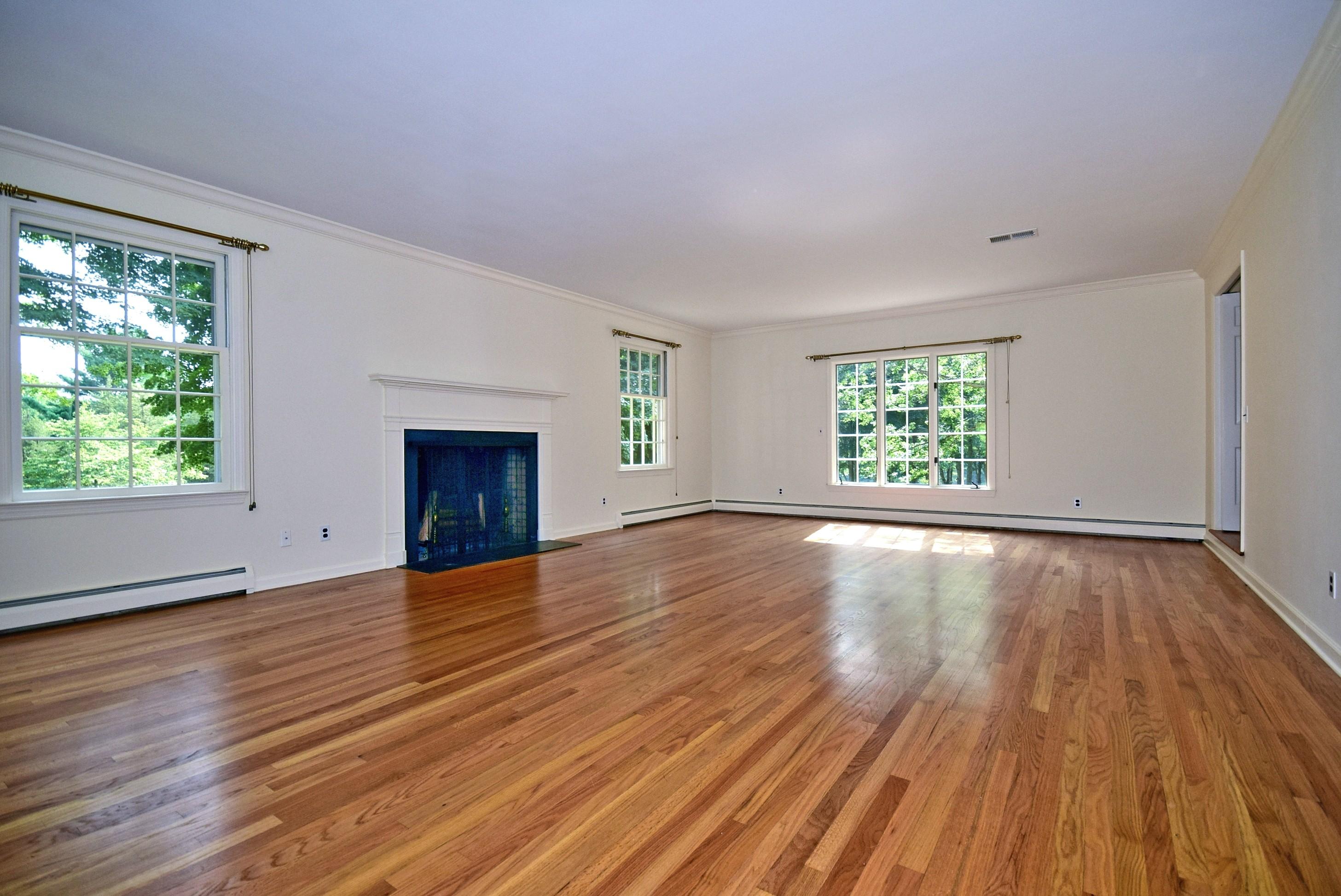 1342 Valley Road New Canaan, CT 06840 - Photo 3 of 10 an empty room with wooden floor and windows