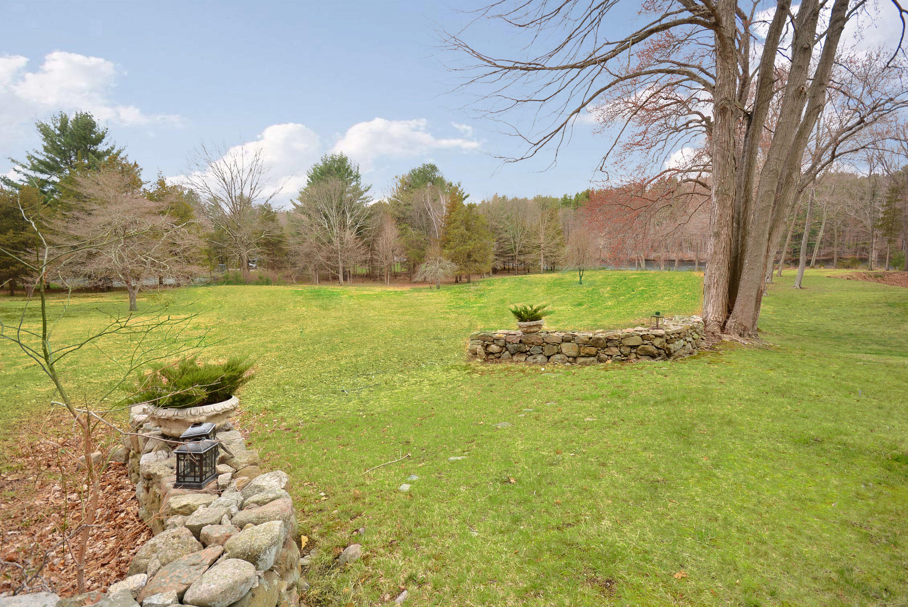 1342 Valley Road New Canaan, CT 06840 - Photo 8 of 10 a view of a lake with a yard