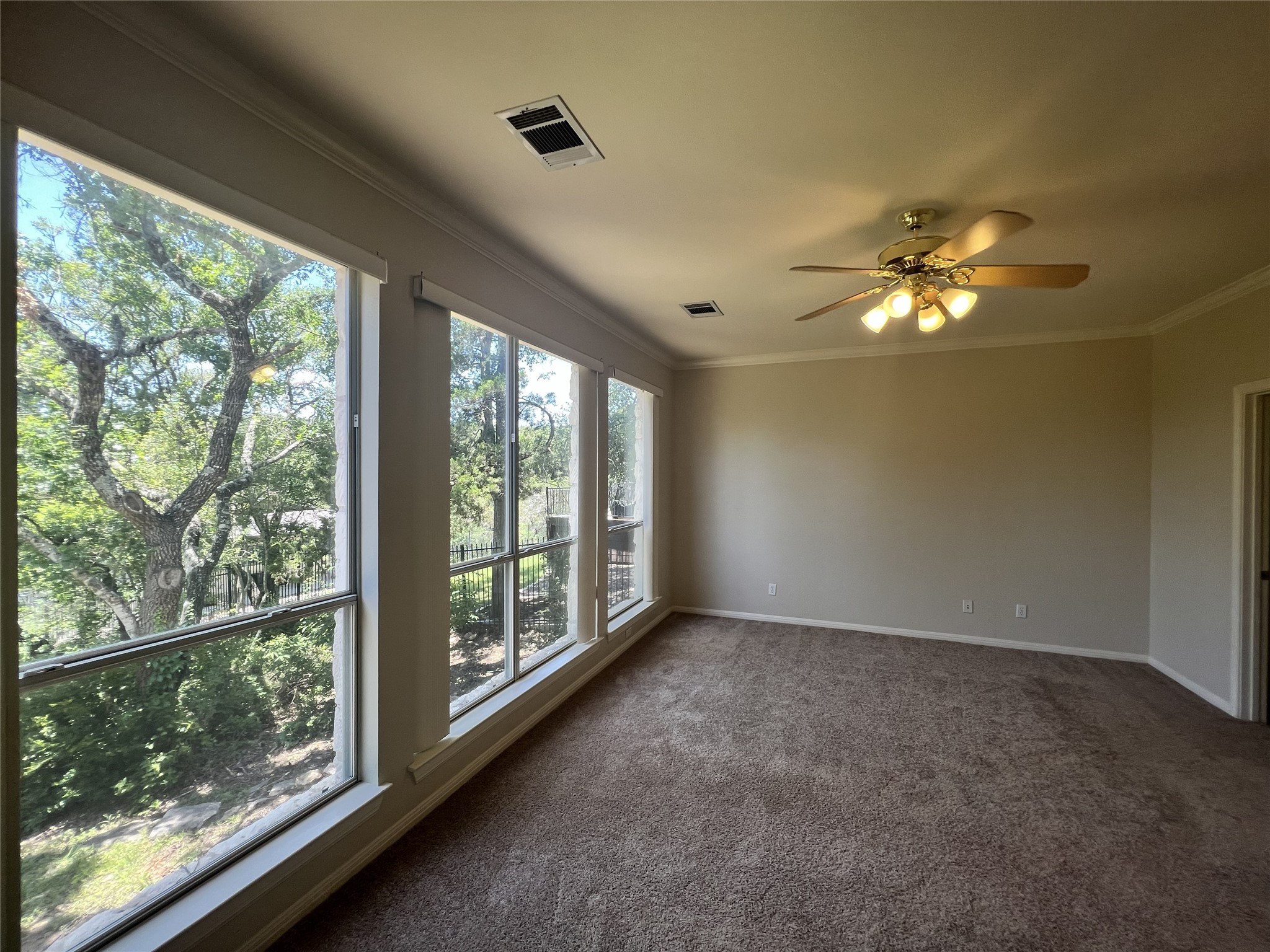 9405 Ashton Ridge Austin, TX 78750 - Photo 18 of 22 A spacious room offers captivating views through its broad, tall windows.