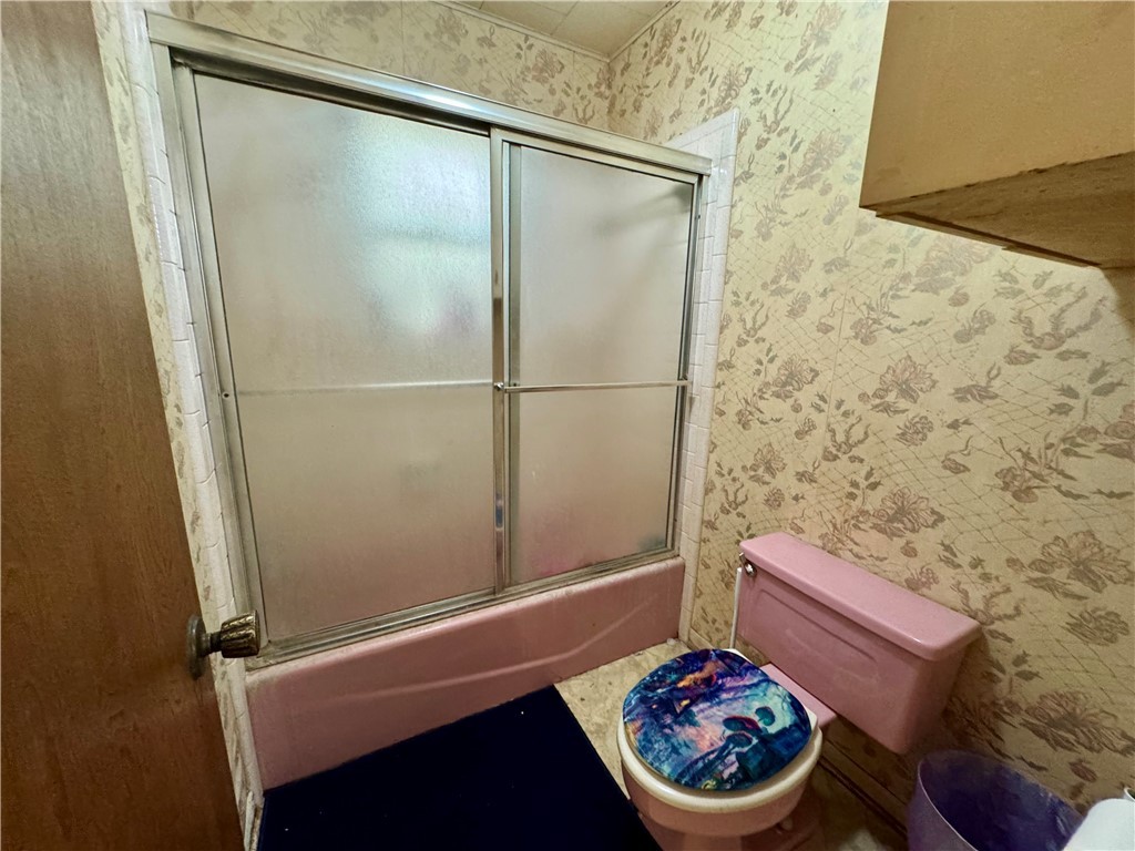 7611 Schramm Road La Grange, TX 78945 - Photo 18 of 30 a bathroom with a toilet and a shower