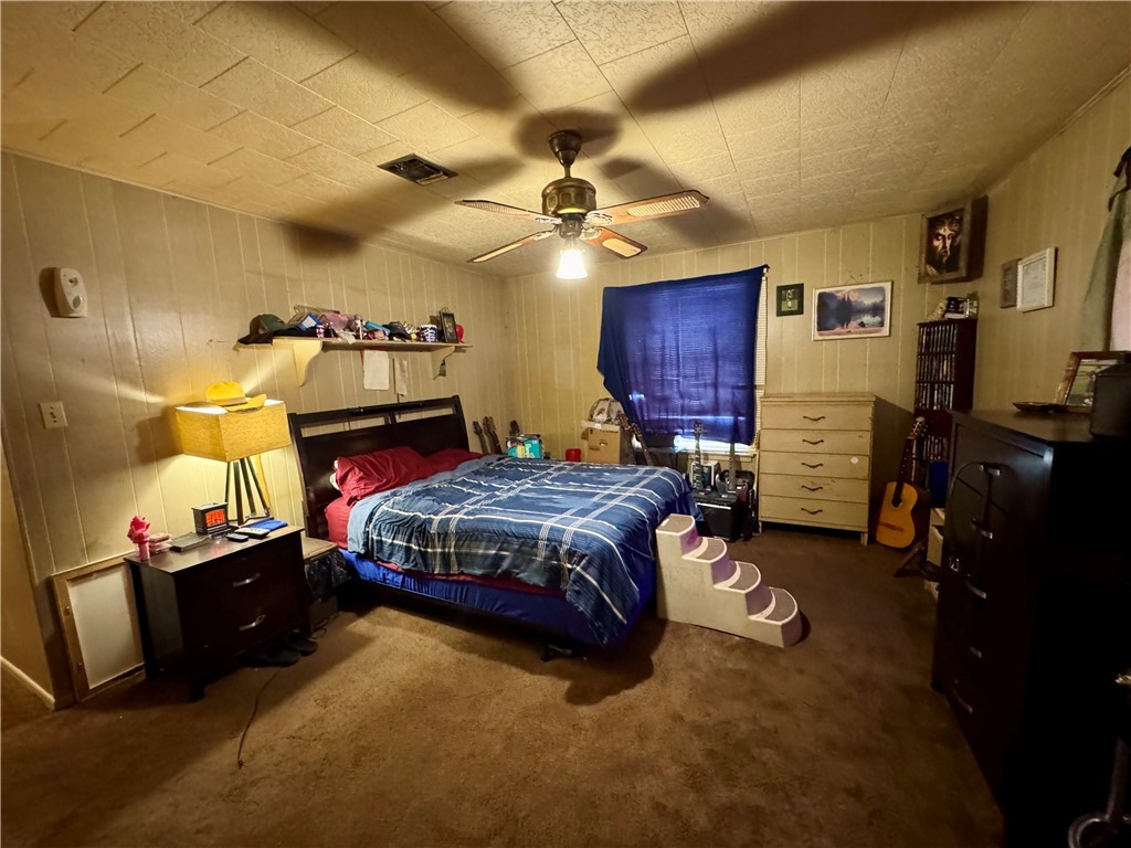 7611 Schramm Road La Grange, TX 78945 - Photo 19 of 30 a bedroom with a bed dresser and a window