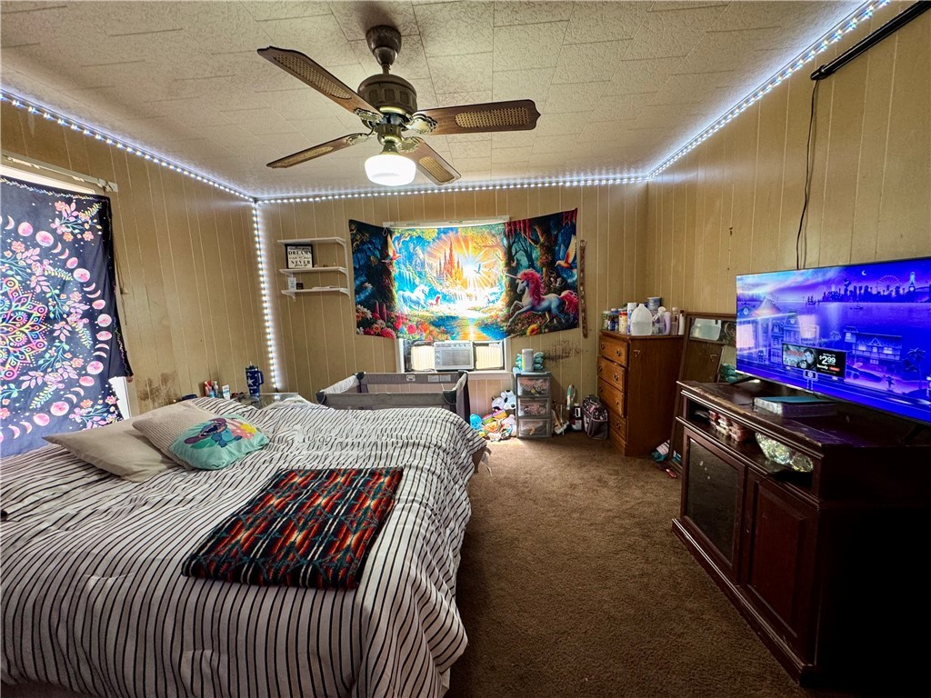 7611 Schramm Road La Grange, TX 78945 - Photo 21 of 30 a bedroom with furniture and a flat screen tv