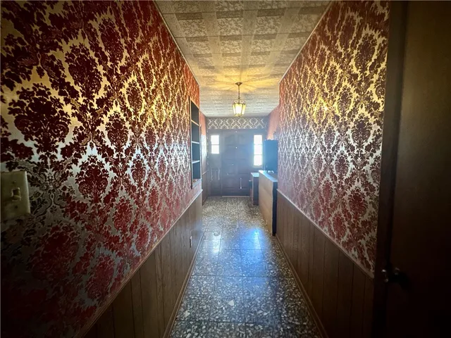 a hallway with wooden floor