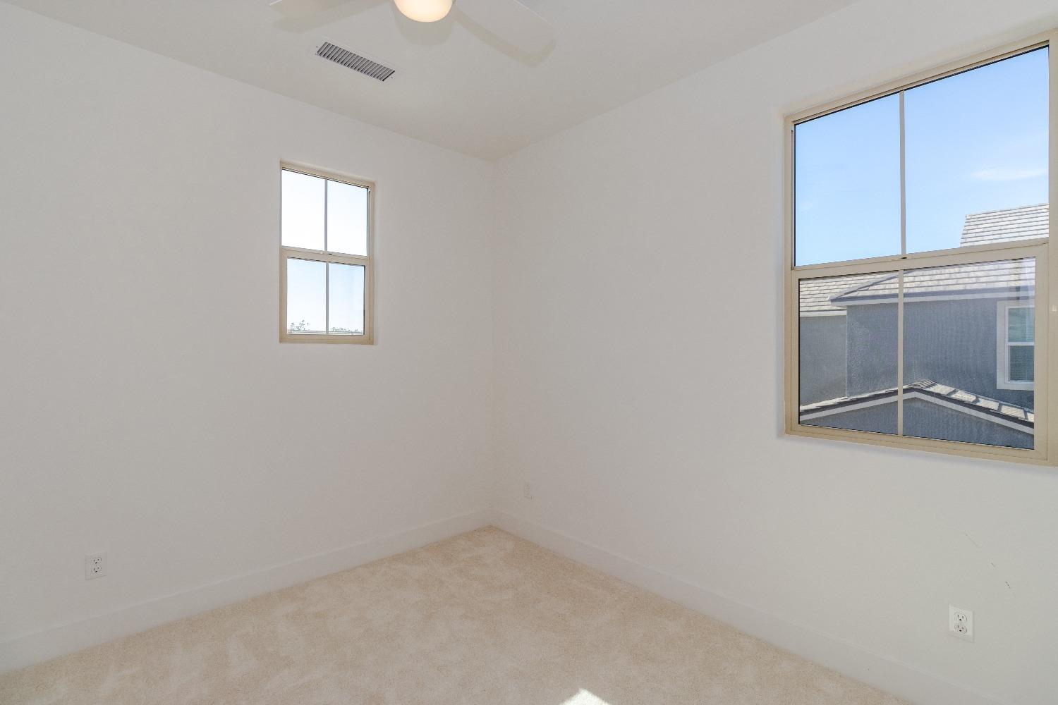4344 Oak Knoll Road Madera, CA 93636 - Photo 25 of 33 an empty room with windows