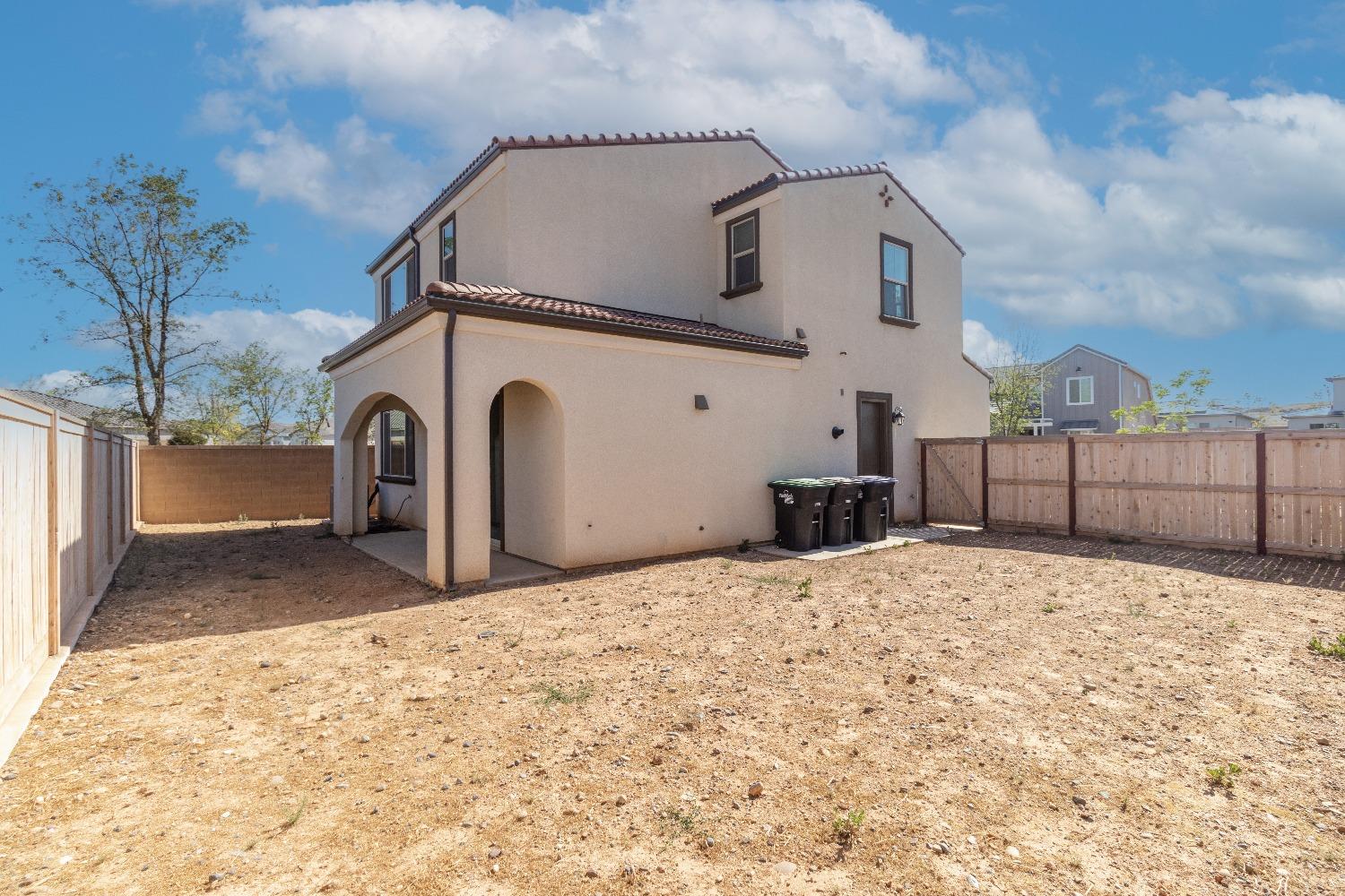 4344 Oak Knoll Road Madera, CA 93636 - Photo 31 of 33 a view of a white house with a yard