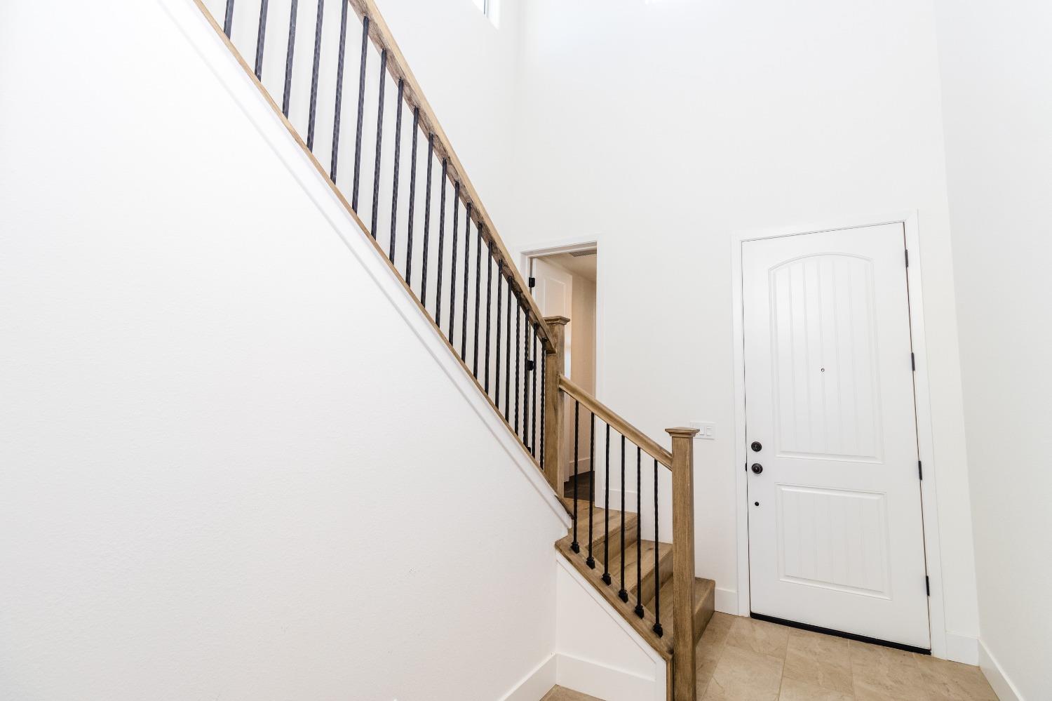 4344 Oak Knoll Road Madera, CA 93636 - Photo 5 of 33 a view of staircase with railing and white walls