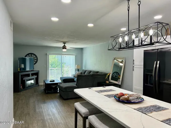 a table and chairs sitting in a kitchen