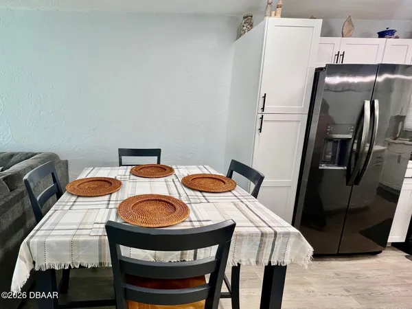 a bedroom with a bed and a ceiling fan