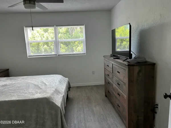 a bathroom with a sink a toilet a shower curtain and a shower curtain